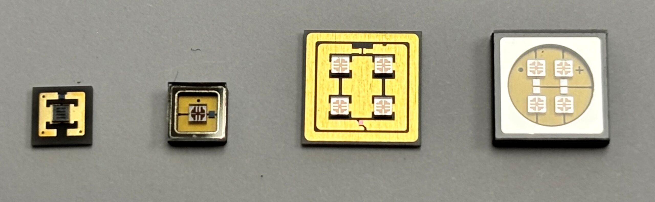 Images of UVC 280 nanometer LEDs with single chips and four chips and lens cap and no lens options